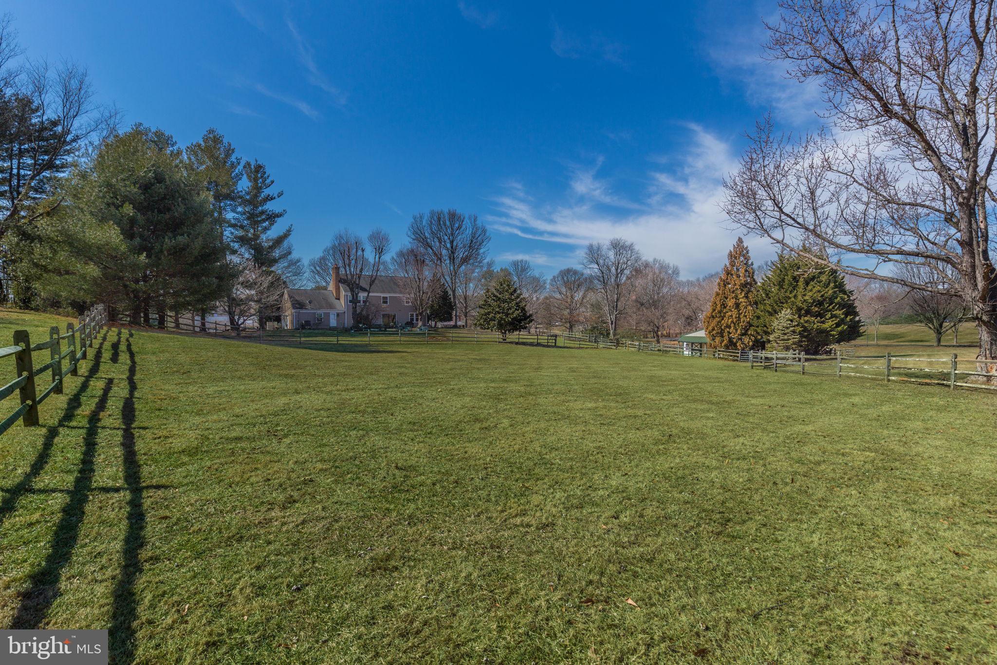 14709 Spring Meadows Drive Darnestown, MD 20874 - Photo 38 of 40 a view of a field with trees around in front of it