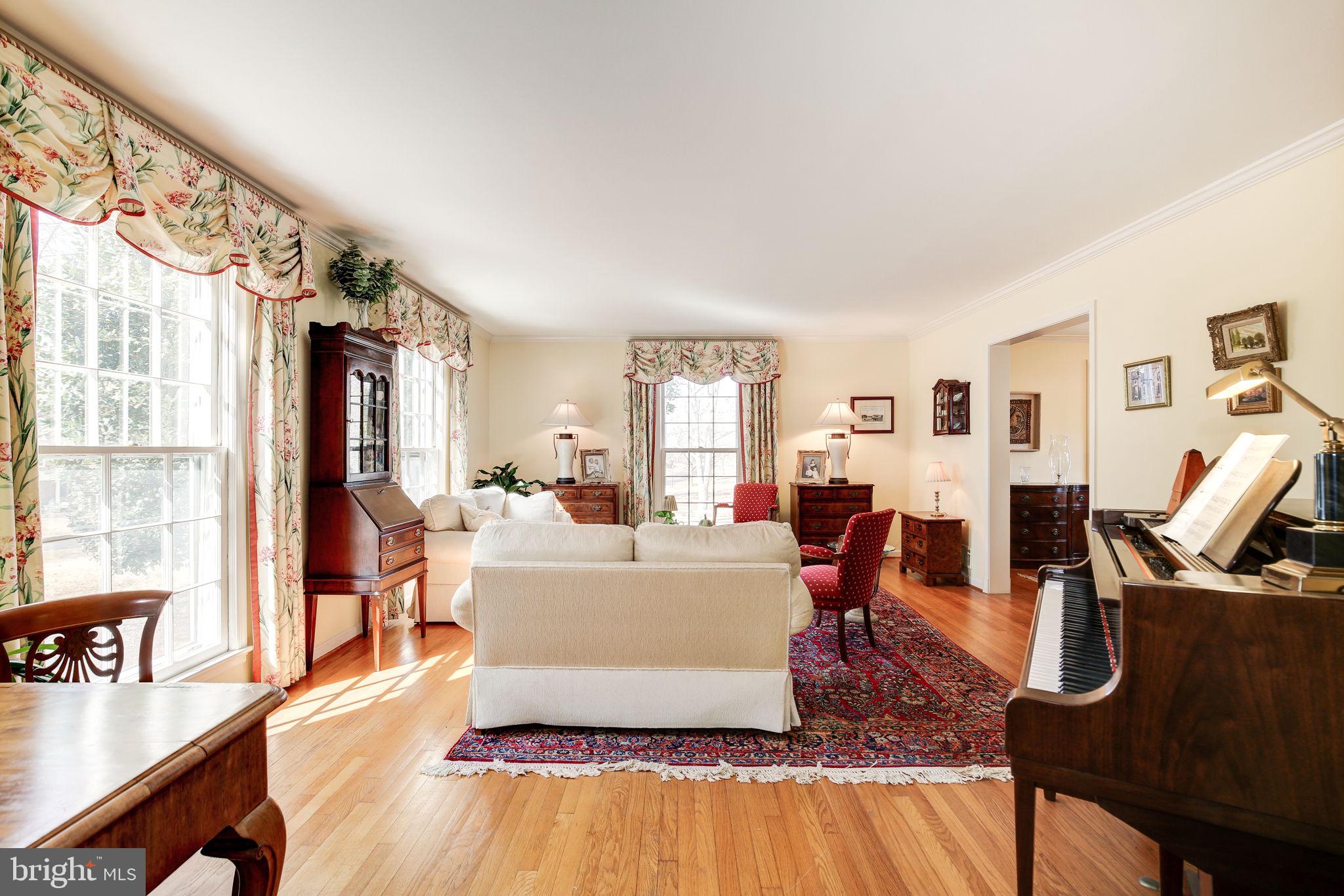 14709 Spring Meadows Drive Darnestown, MD 20874 - Photo 6 of 40 a living room with furniture large window and wooden floor