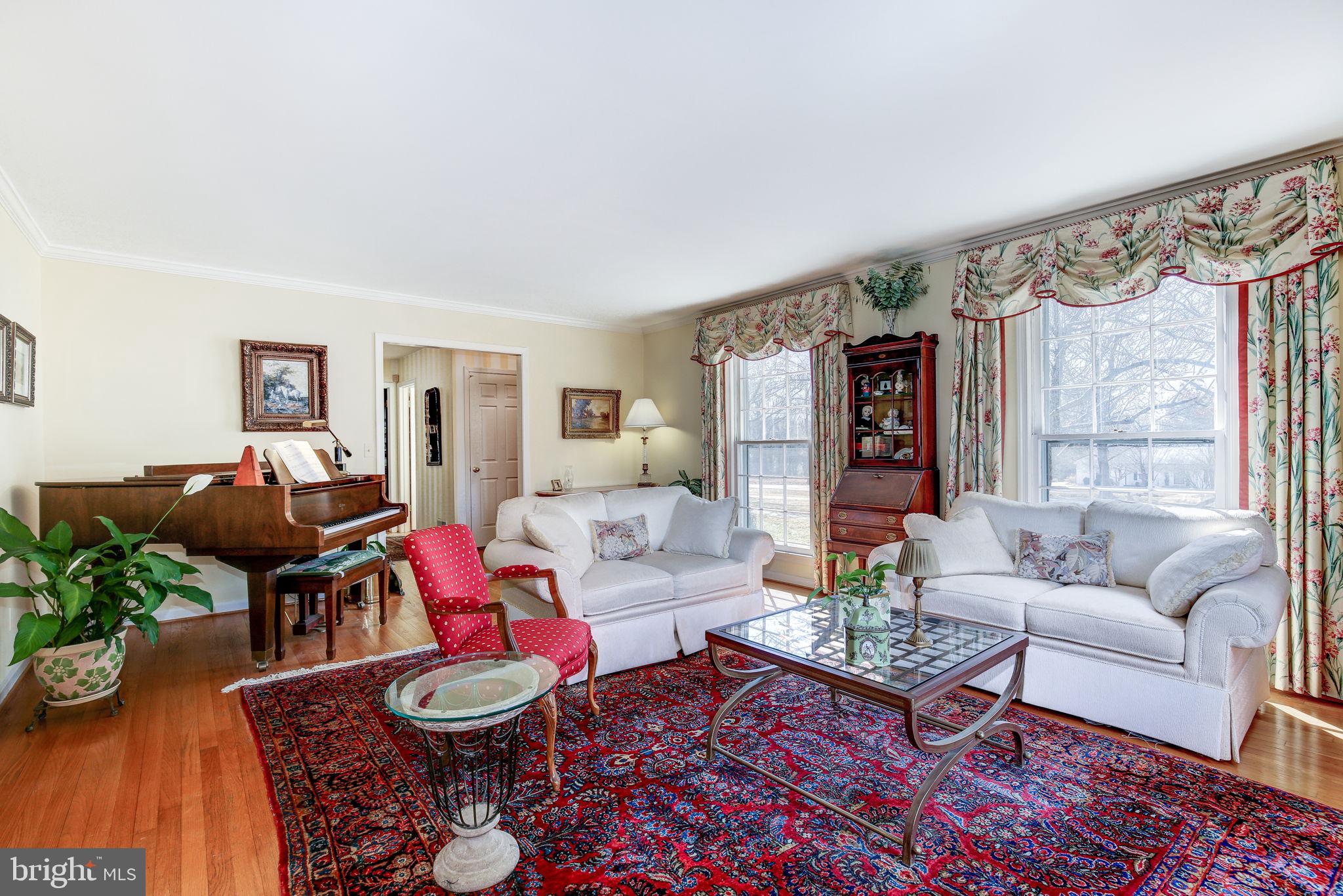14709 Spring Meadows Drive Darnestown, MD 20874 - Photo 7 of 40 a living room with furniture and wooden floor