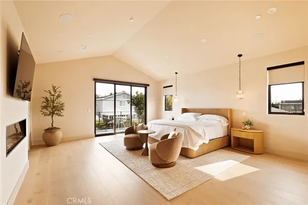 a bed room with a bed and a television