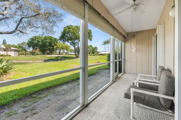 a view of swimming pool with seating space