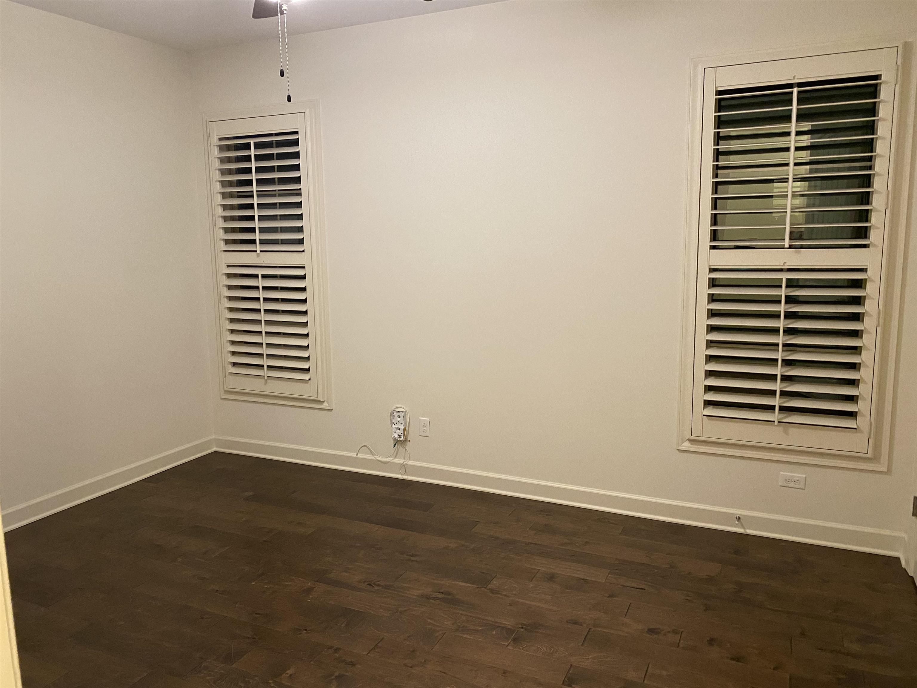 4713 Emmas Circle West Collierville, TN 38017 - Photo 15 of 25 a view of an empty room with wooden floor and a window