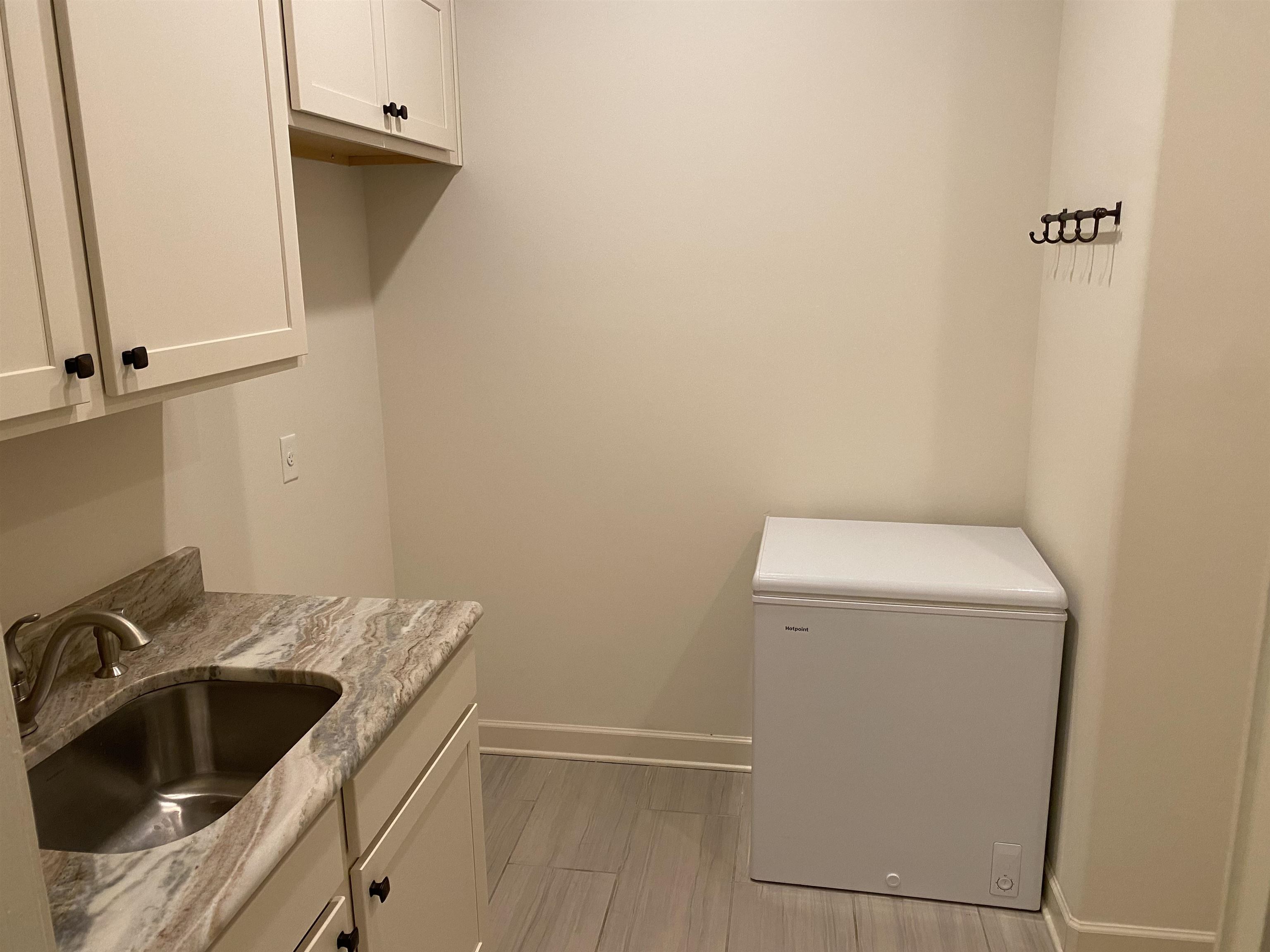 4713 Emmas Circle West Collierville, TN 38017 - Photo 21 of 25 a view of a storage and utility room with a sink