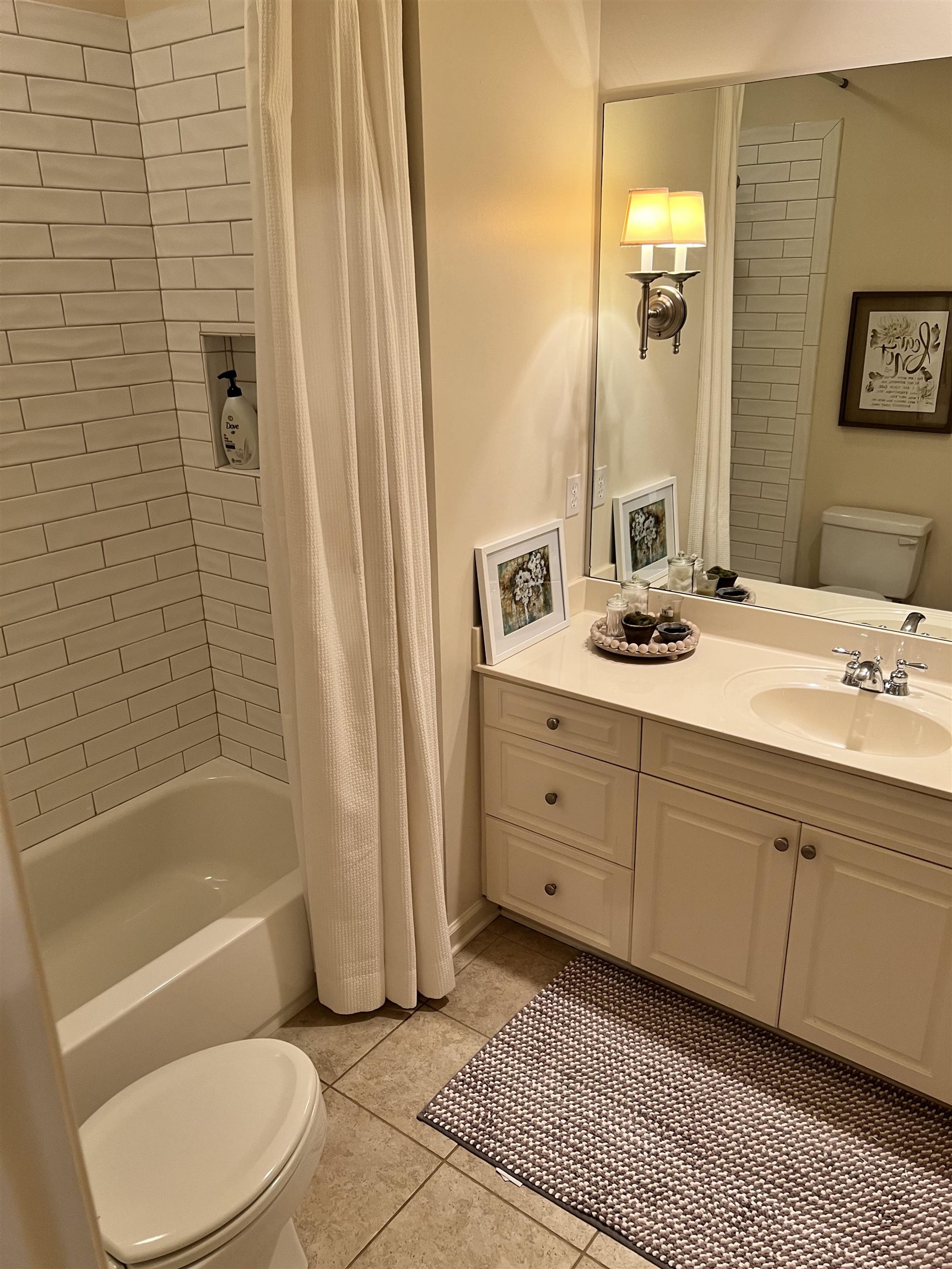 5110 Barry Road Memphis, TN 38117 - Photo 20 of 25 a bathroom with a sink a toilet and shower