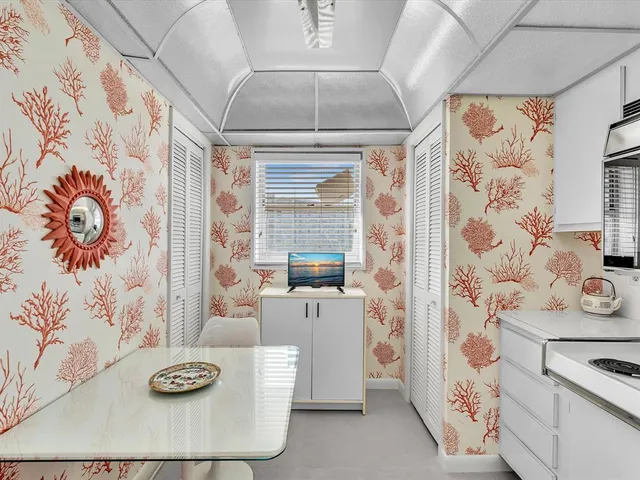 a kitchen with stainless steel appliances a sink a stove a refrigerator and cabinets