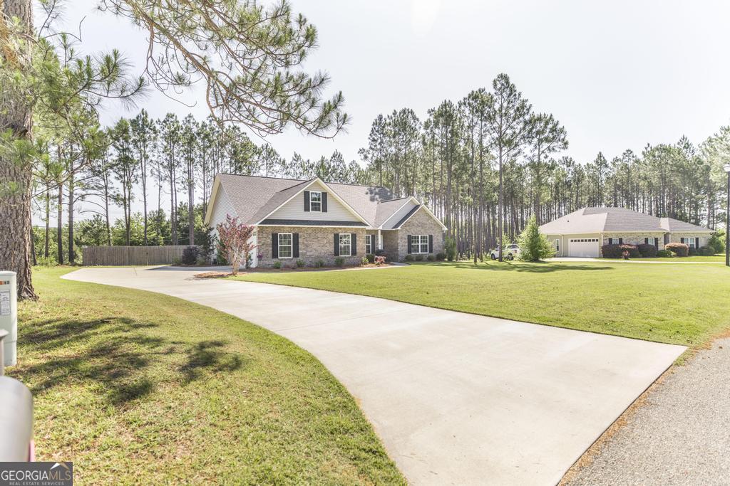 609 Live Oak Way Dublin, GA 31021 - Photo 3 of 37 a view of house with swimming pool and yard
