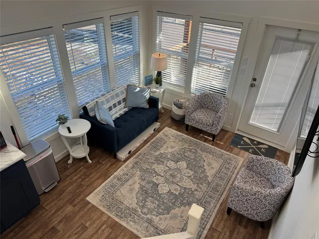 a living room with furniture and a rug