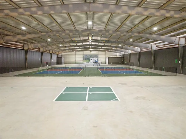 a view of a swimming pool with a lounge chairs