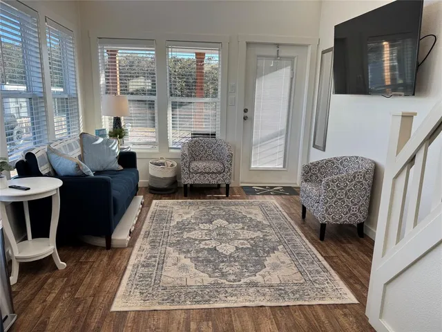 a living room with furniture and a rug