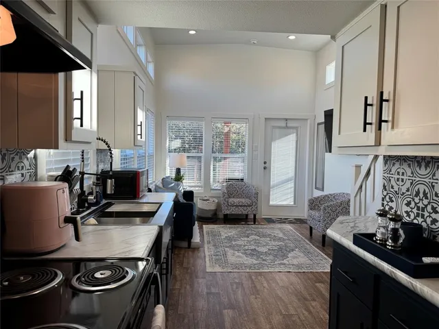 a kitchen with a stove and a refrigerator