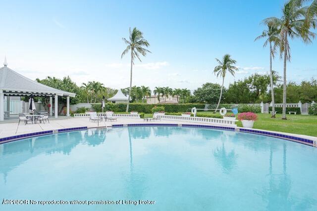 2165 Ibis Isle Road, Unit 14 Palm Beach, FL 33480 - Photo 34 of 41 a view of a swimming pool and a terrace