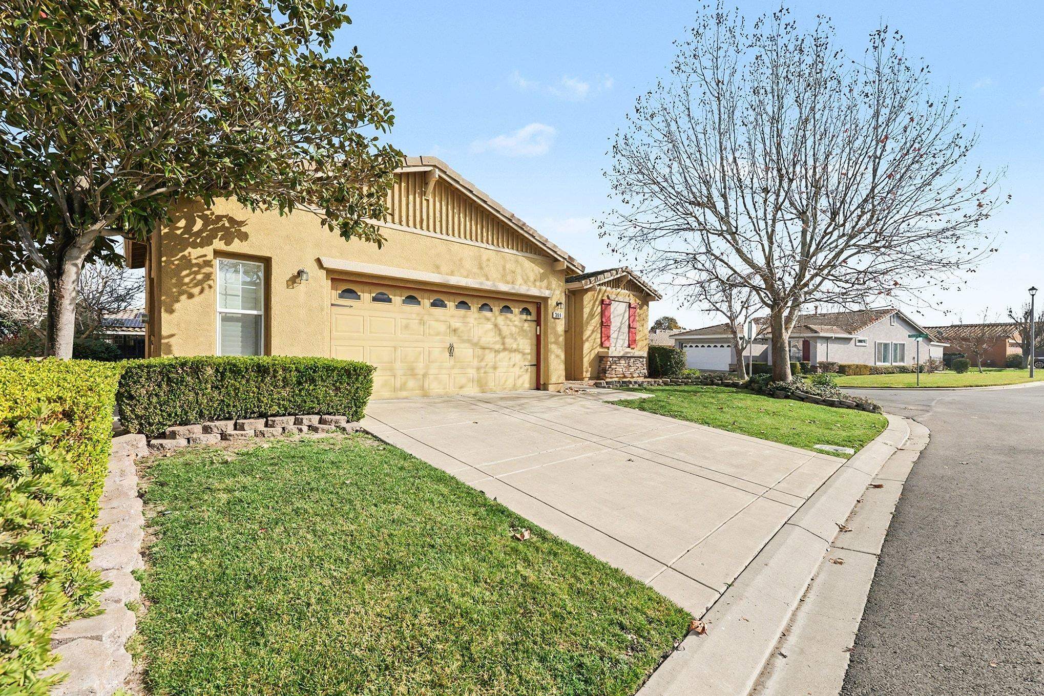 369 Whistling Straits Way Rio Vista, CA 94571 - Photo 4 of 28 a front view of a house with a yard and trees