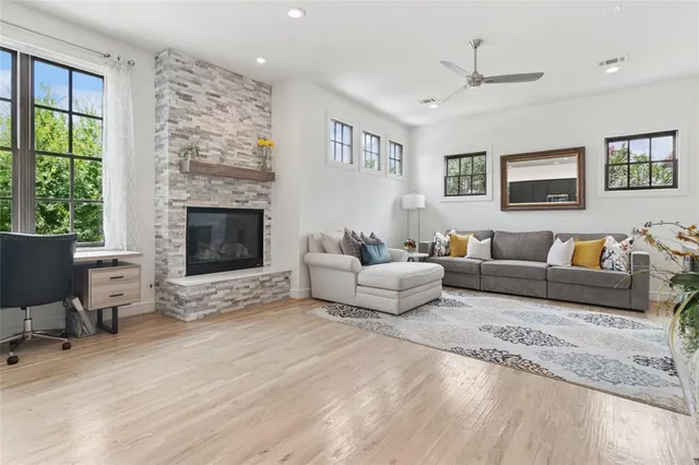 a living room with furniture and a fireplace
