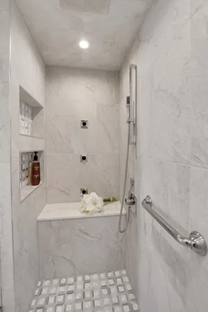 a bathroom with a shower and a sink