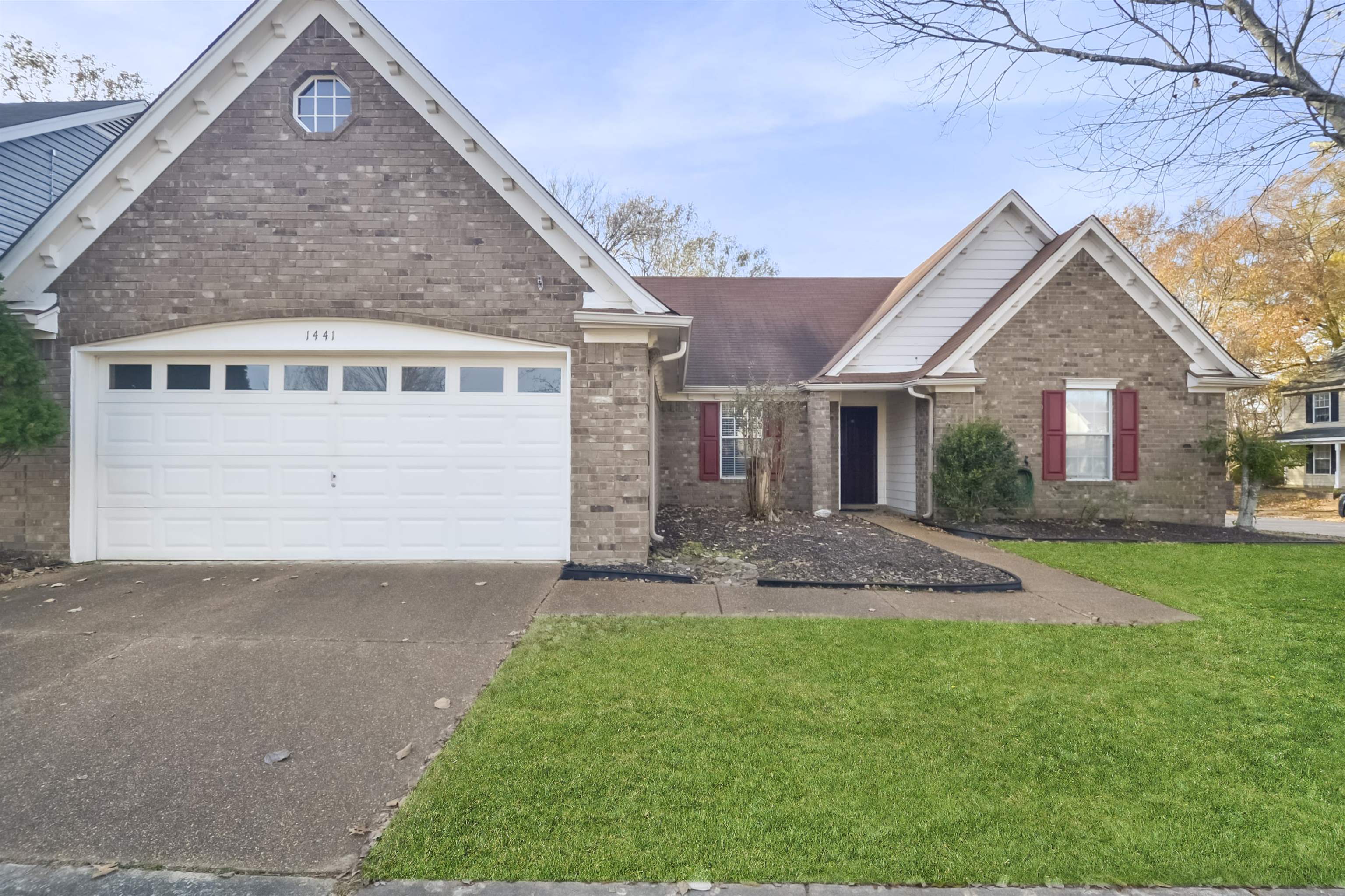 1441 Milestone Circle Collierville, TN 38017 - Photo 1 of 27 a front view of a house with a yard and garage