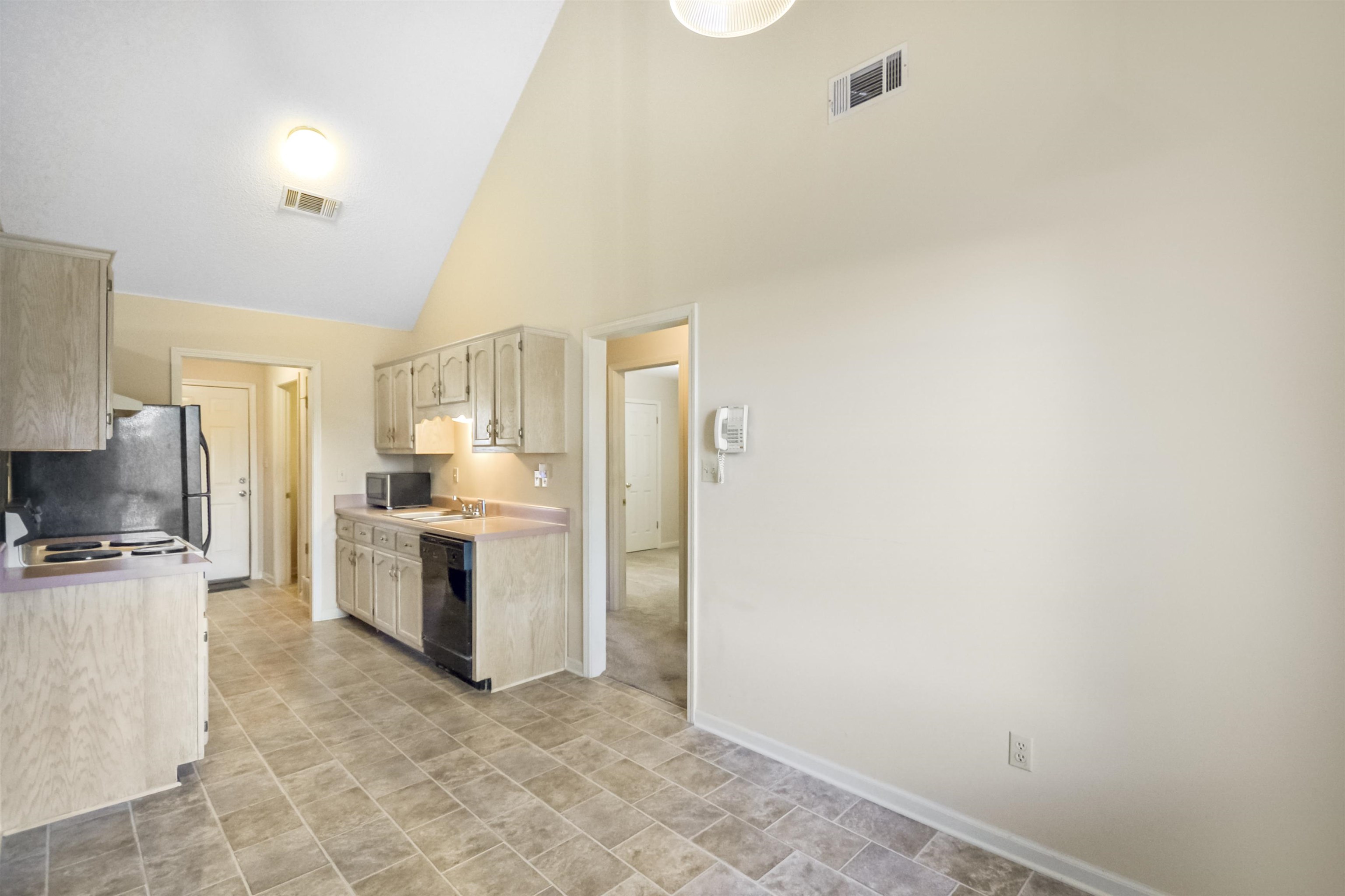 1441 Milestone Circle Collierville, TN 38017 - Photo 16 of 27 a kitchen with a refrigerator and a stove