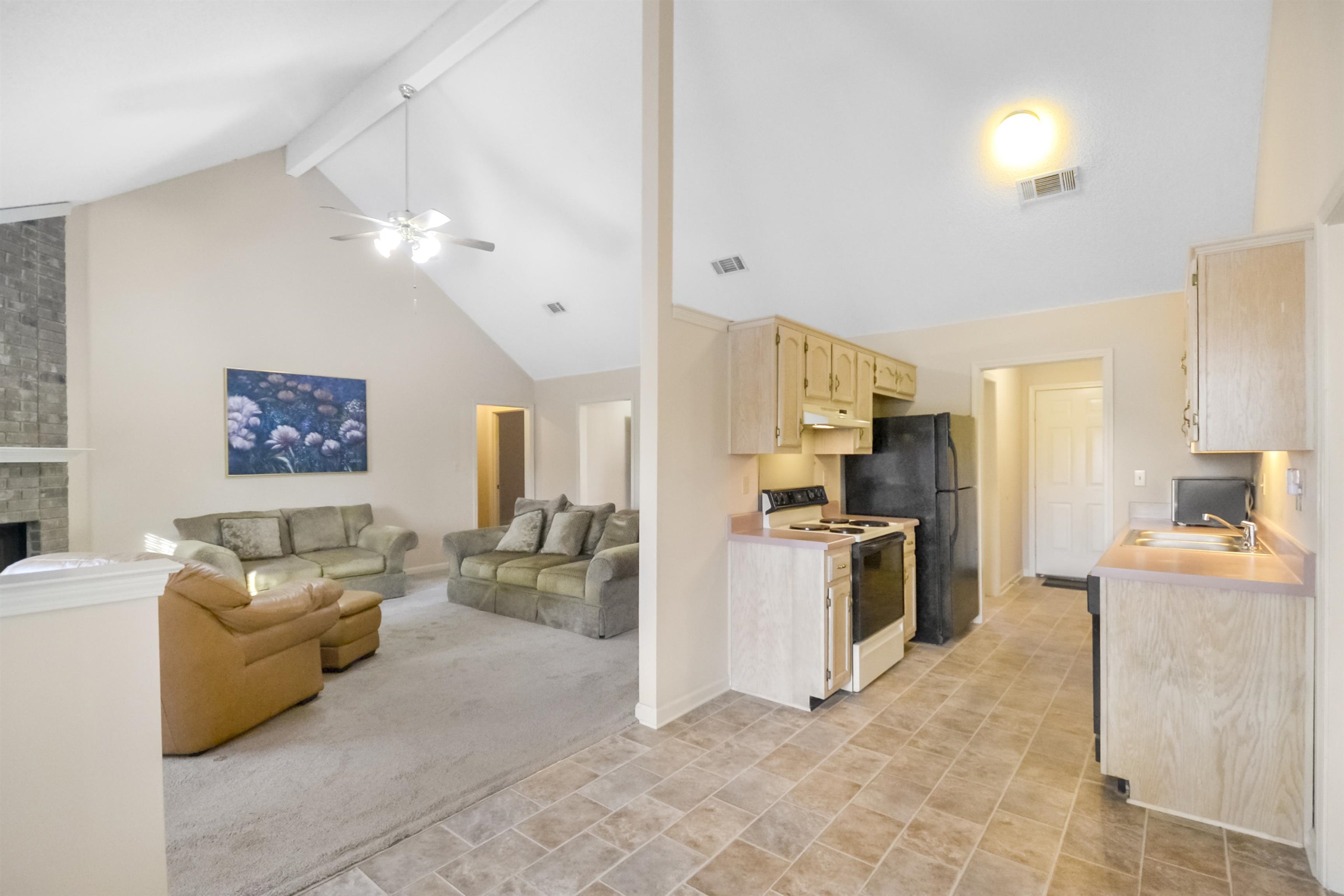 1441 Milestone Circle Collierville, TN 38017 - Photo 17 of 27 a kitchen with stainless steel appliances granite countertop a refrigerator oven stove a sink dishwasher and white cabinets with wooden floor