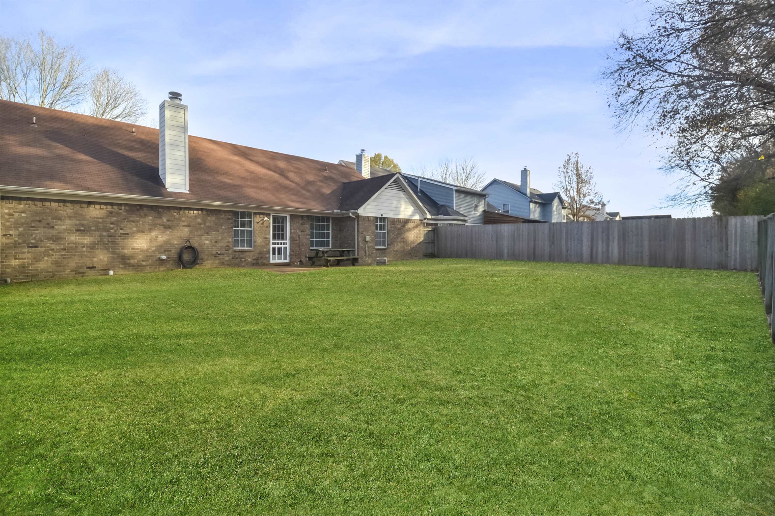 1441 Milestone Circle Collierville, TN 38017 - Photo 27 of 27 a view of a house with a yard and sitting area