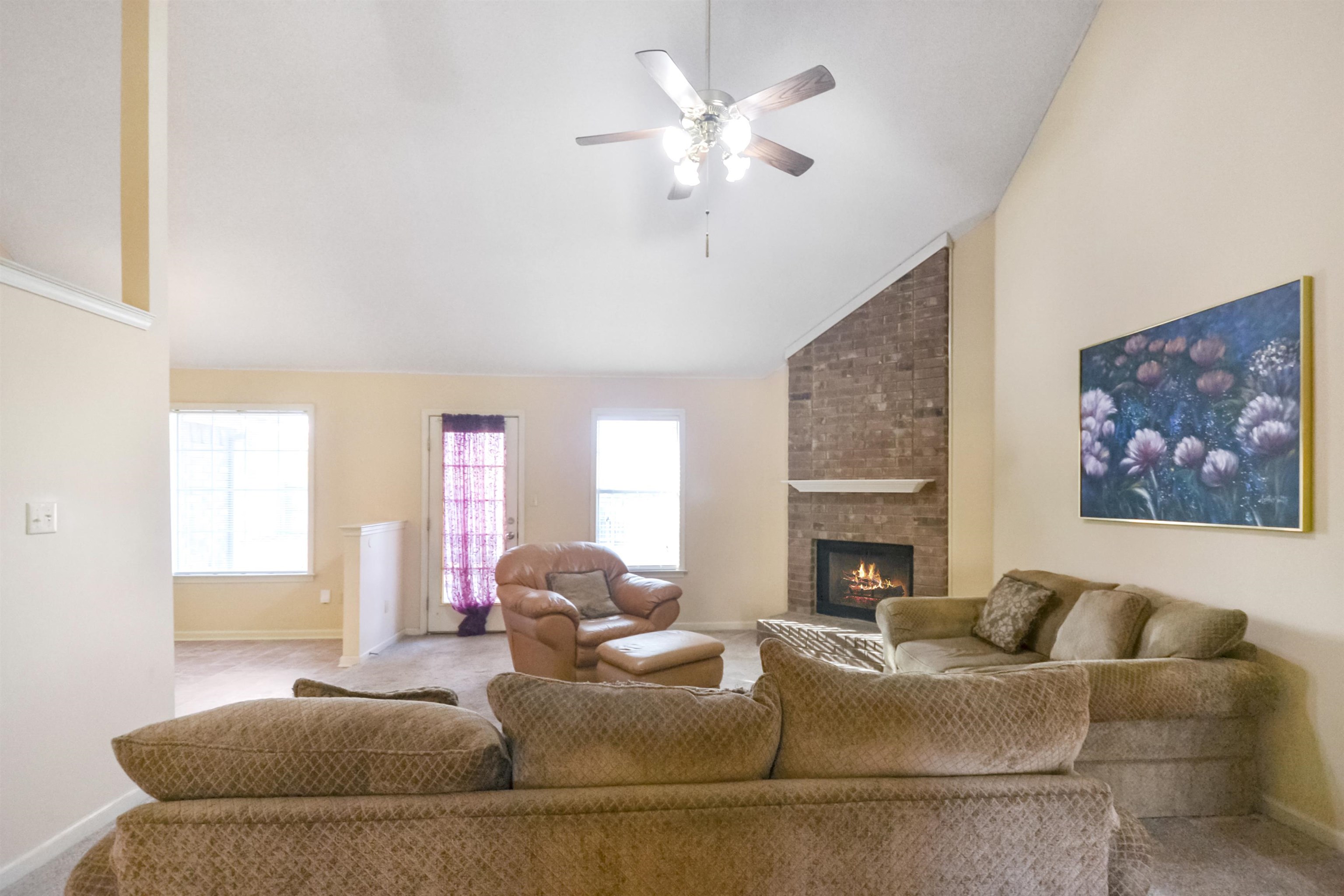 1441 Milestone Circle Collierville, TN 38017 - Photo 6 of 27 a living room with fireplace furniture and a large window