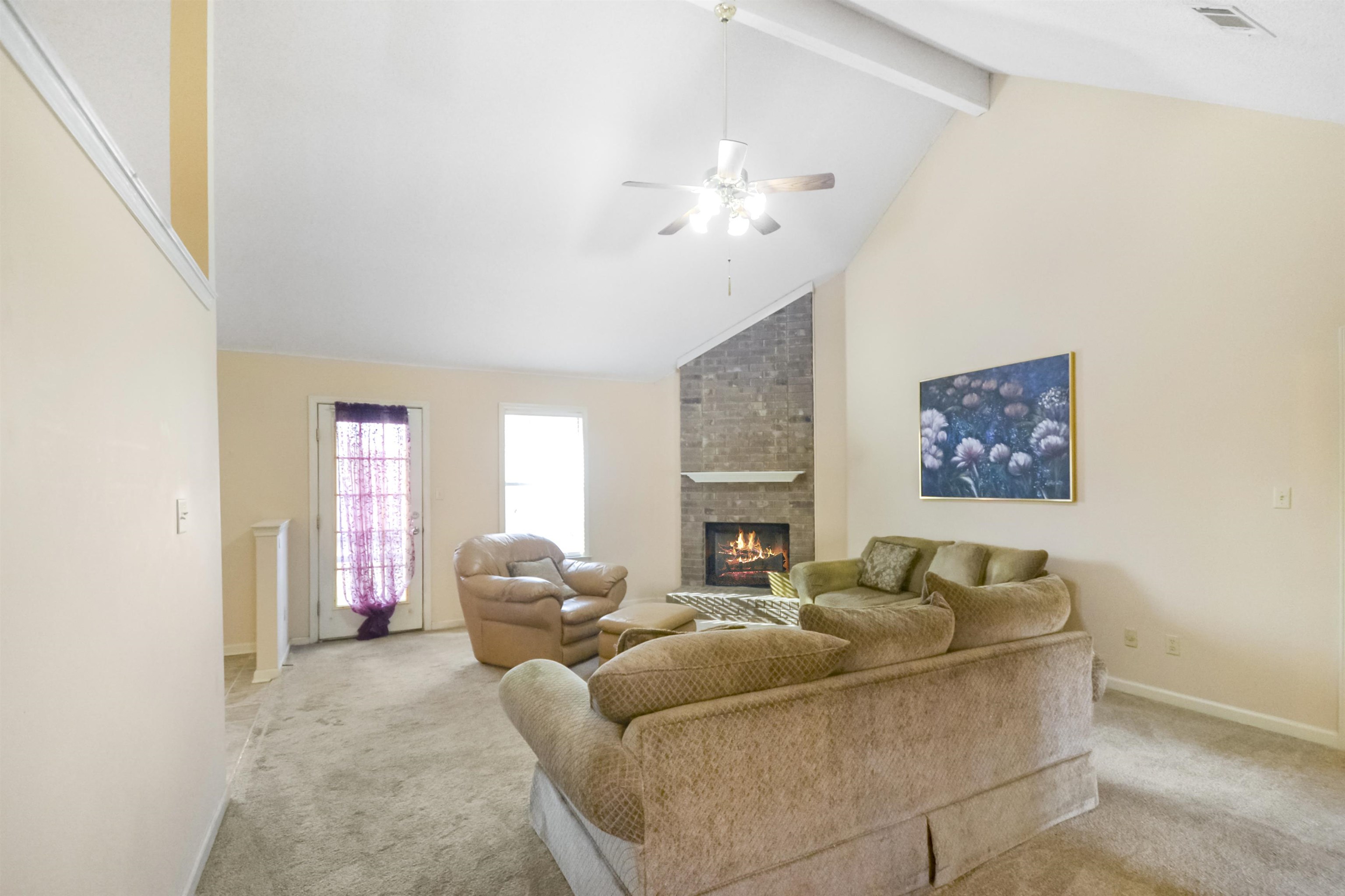 1441 Milestone Circle Collierville, TN 38017 - Photo 7 of 27 a living room with furniture and a fireplace