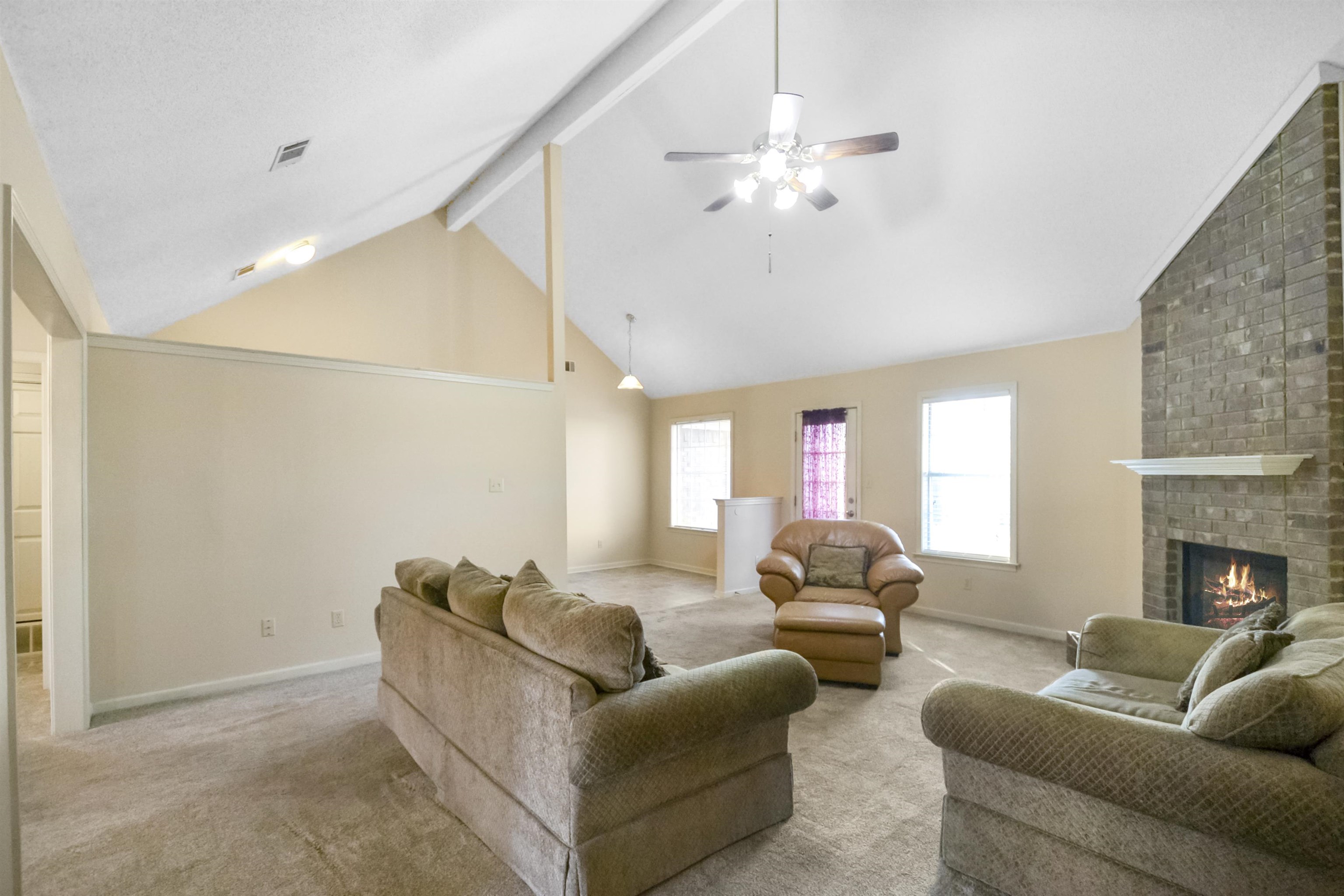 1441 Milestone Circle Collierville, TN 38017 - Photo 8 of 27 a living room with furniture and a fireplace