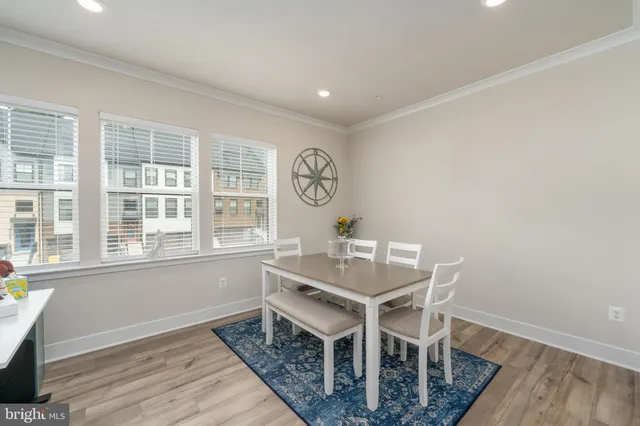 a workspace with furniture window and wooden floor