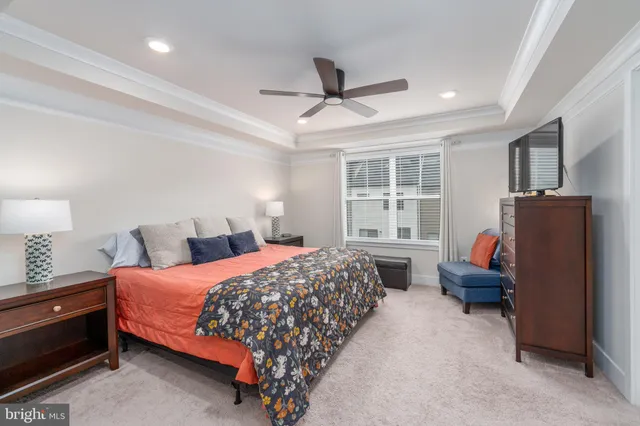 a bedroom with a bed and a television