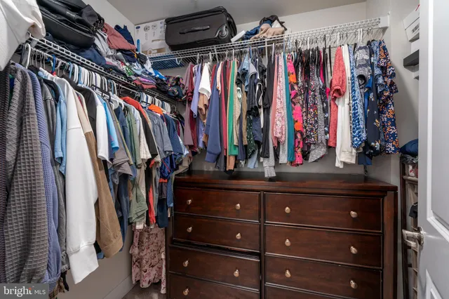 a bathroom with a granite countertop sink mirror and double