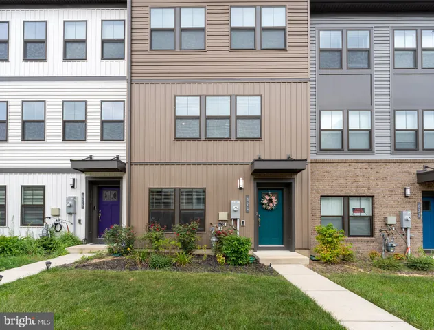 a black and white photo of a bench