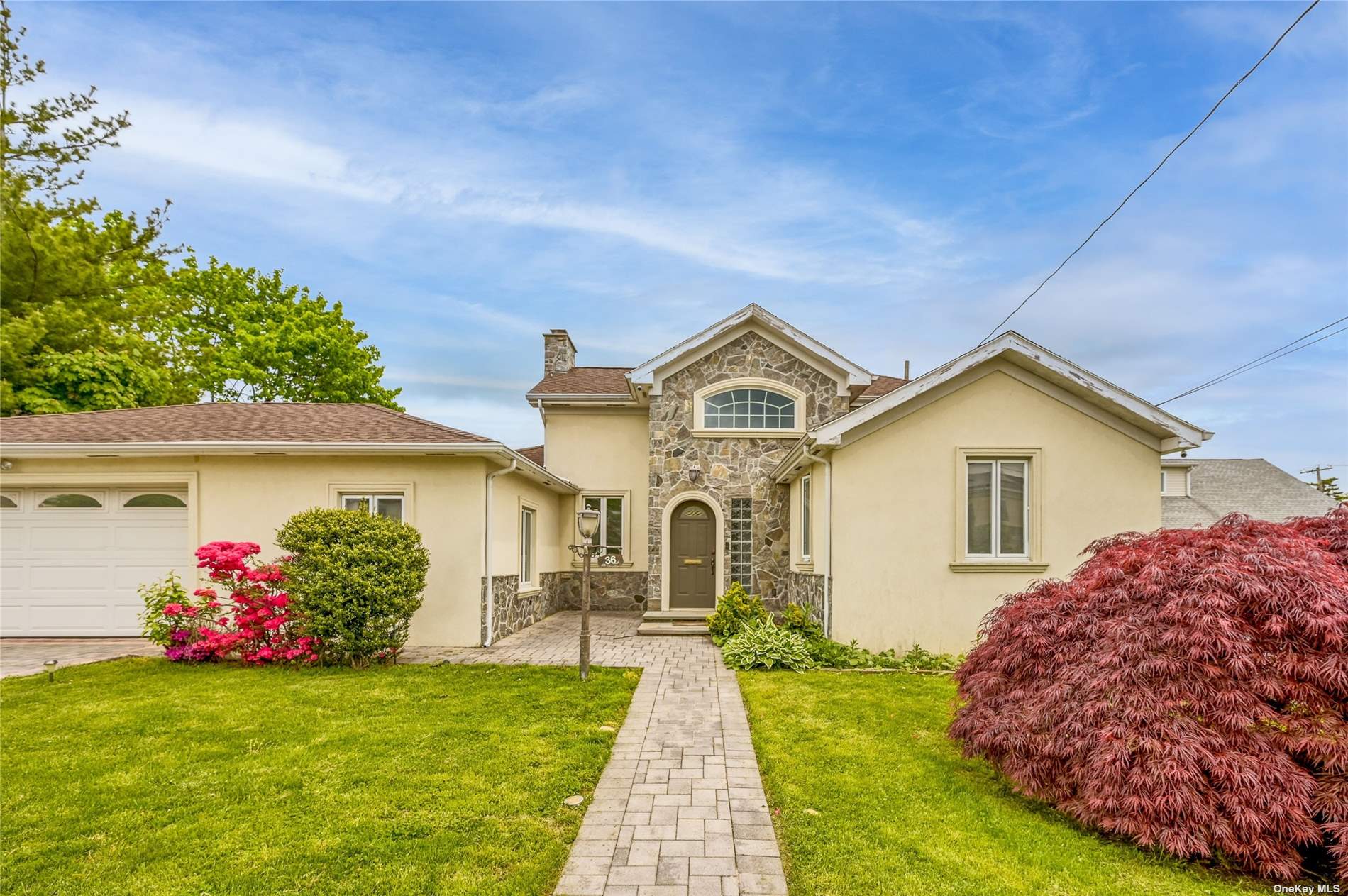 36 Marwood Road South Port Washington, NY 11050 - Photo 1 of 1 a front view of a house with a yard