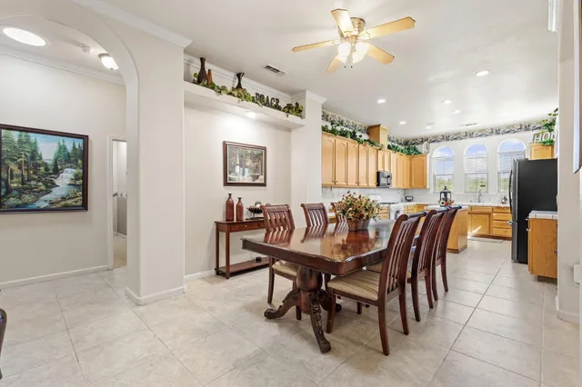a kitchen with a refrigerator and a sink