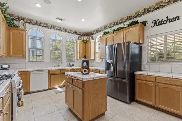 a spacious bedroom with a bed and a window