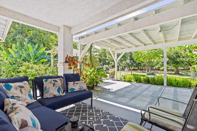 a view of a two chairs in the patio