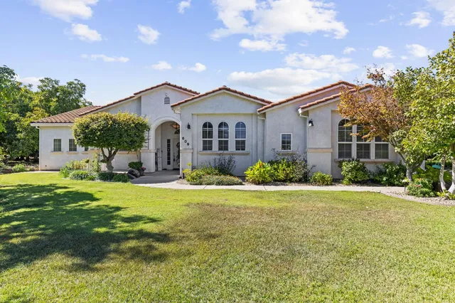a front view of a house with a yard