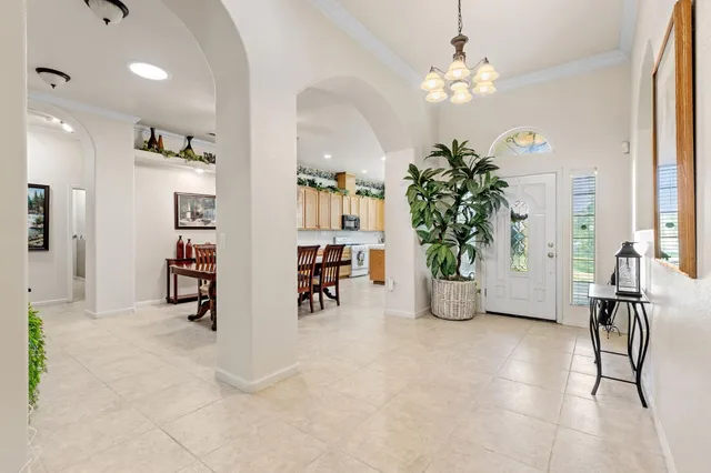 a kitchen with refrigerator and cabinets