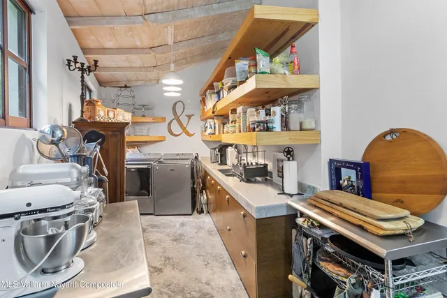a kitchen with stainless steel appliances granite countertop a stove and a refrigerator