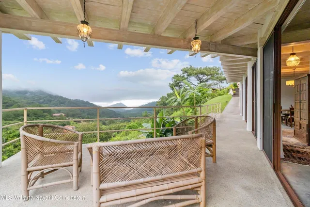 a patio with table and chairs
