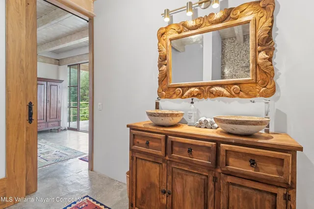 a bathroom with a sink and a mirror
