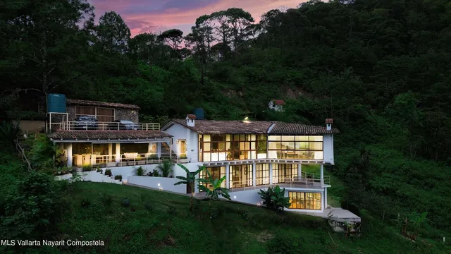 a front view of a house with a yard table and chairs