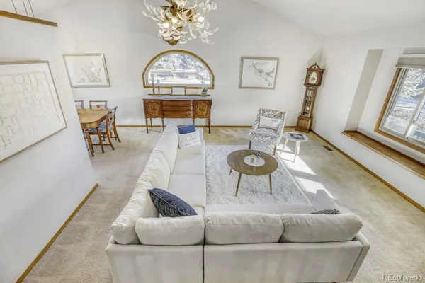 a kitchen with stainless steel appliances granite countertop a refrigerator a stove top oven a sink and dishwasher