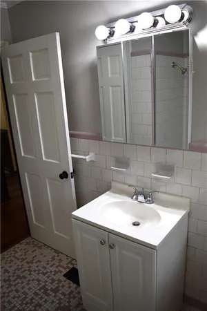 a bathroom with a sink and mirror