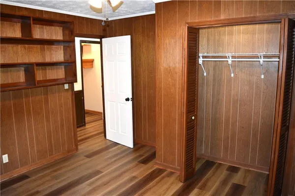 a view of a door and wooden floor