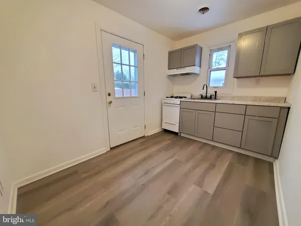 a kitchen with sink cabinets and window