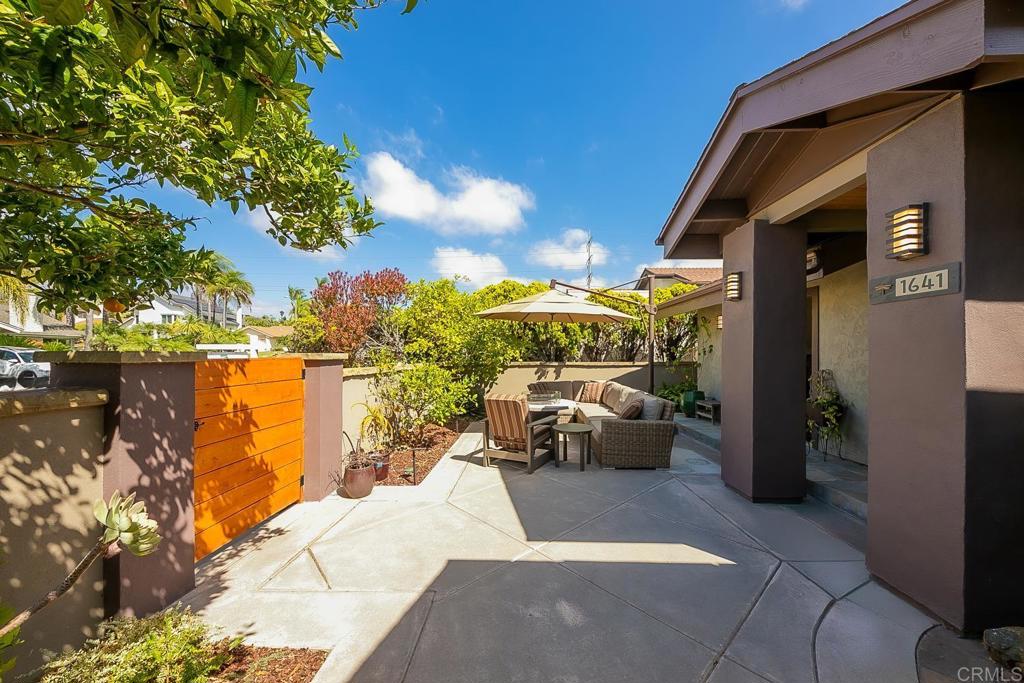 1641 Tucker Lane Encinitas, CA 92024 - Photo 2 of 58 a view of a patio with couches and potted plants