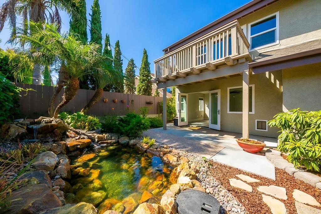 1641 Tucker Lane Encinitas, CA 92024 - Photo 31 of 58 a view of a brick house with a yard plants and large tree