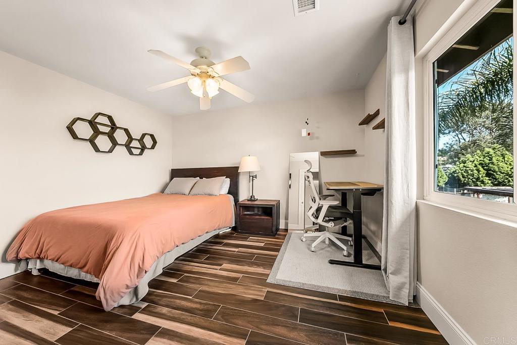 1641 Tucker Lane Encinitas, CA 92024 - Photo 44 of 58 a bedroom with a bed and a window