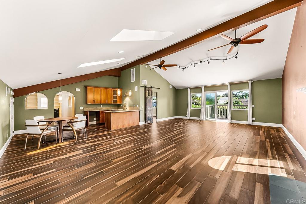 1641 Tucker Lane Encinitas, CA 92024 - Photo 50 of 58 a view of a dining room with furniture window and wooden floor