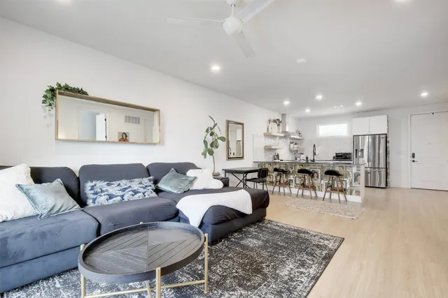 a living room with furniture and a table