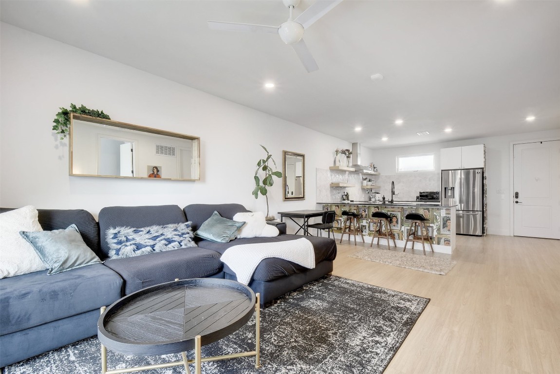 2709 East 5th Street, Unit 2303 Austin, TX 78702 - Photo 6 of 18 a living room with furniture and a table