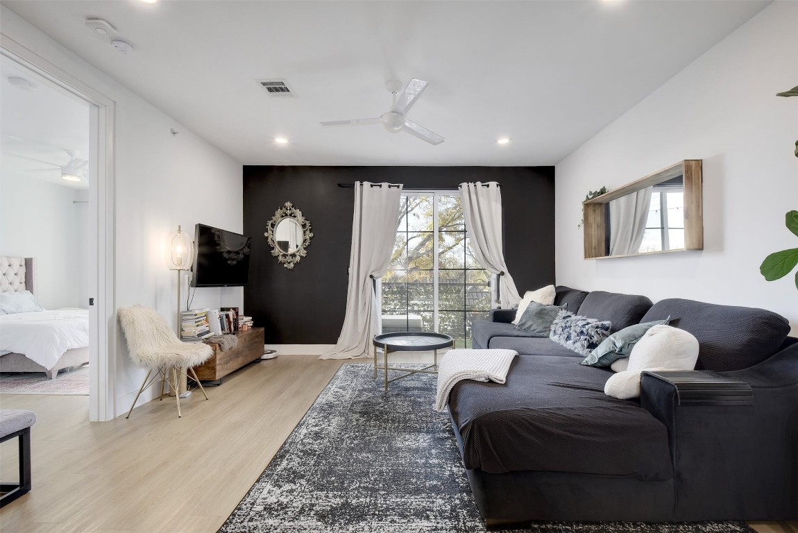 2709 East 5th Street, Unit 2303 Austin, TX 78702 - Photo 7 of 18 a living room with furniture and a large window